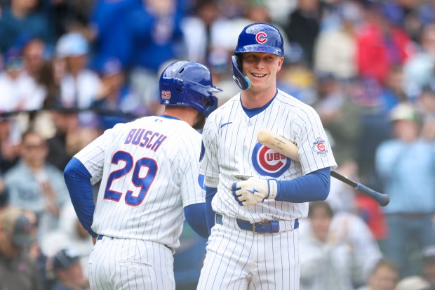 Chicago Cubs center fielder Pete Crow-Armstrong (4) smiles as first baseman Michael Busch (29) scores in the second inning against the Arizona Diamondbacks at Wrigley Field on May 3, 2026. (Eileen T. Meslar/Chicago Tribune)