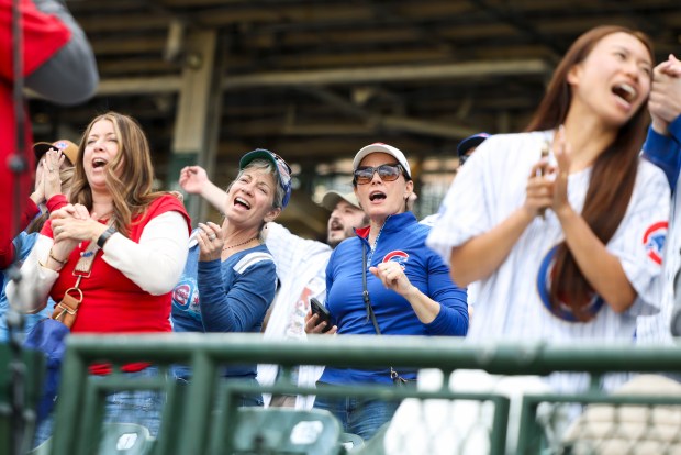 Fans sing and dance to "Go, Cubs, Go" after the Chicago Cubs defeated the Arizona Diamondbacks 8-4 at Wrigley Field on May 3, 2026. (Eileen T. Meslar/Chicago Tribune)