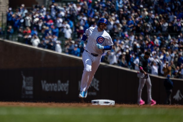 Chicago Cubs left fielder Ian Happ runs from second to third base in the after hitting a home run in the second inning of a game against the Arizona Diamondbacks at Wrigley Field in Chicago on May 2, 2026. (Josh Boland/Chicago Tribune)