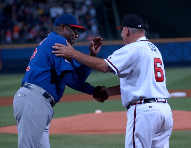 Cubs manager Dusty Baker shakes hands with Braves manager Bobby Cox before Game 1 of a National League Division Series on Sept. 30, 2003, at Turner Field in Atlanta. (Nuccio DiNuzzo/Chicago Tribune)