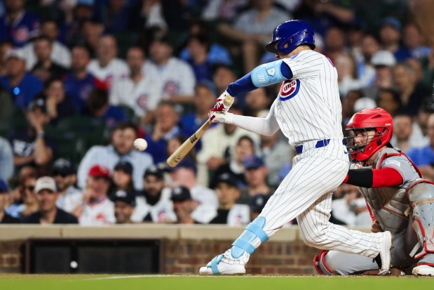 Cubs third baseman Alex Bregman (3) hits a double during the first inning against the Reds at Wrigley Field May 4, 2026, in Chicago. (Armando L. Sanchez/Chicago Tribune)