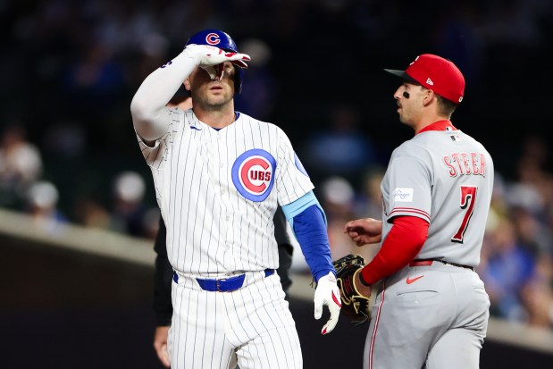 Cubs third baseman Alex Bregman (3) gestures to the Cubs dugout after hitting a double during the first inning against the Reds at Wrigley Field May 4, 2026, in Chicago. (Armando L. Sanchez/Chicago Tribune)