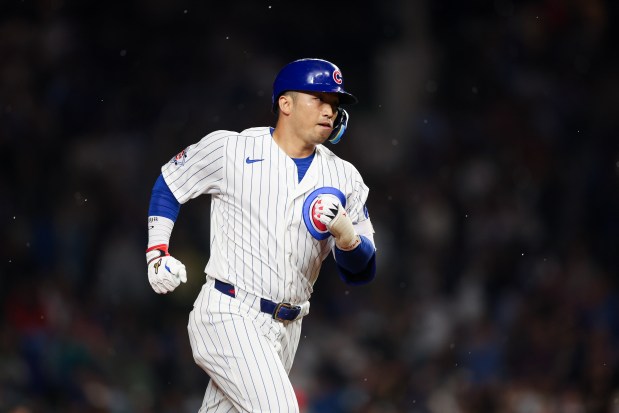 Cubs right fielder Seiya Suzuki (27) runs the bases after hitting a three-run homer during the fourth inning against the Reds at Wrigley Field May 4, 2026, in Chicago. (Armando L. Sanchez/Chicago Tribune)