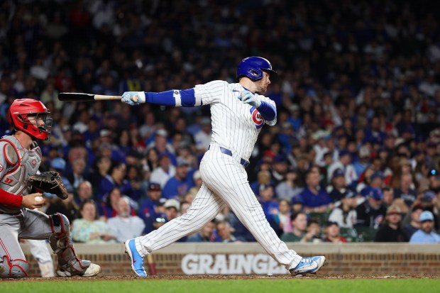 Cubs left fielder Ian Happ (8) strikes out during the sixth inning against the Reds at Wrigley Field May 4, 2026, in Chicago. (Armando L. Sanchez/Chicago Tribune)