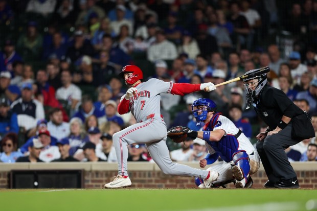 Reds left fielder Spencer Steer (7) hits a RBI single during the eighth inning against the Cubs at Wrigley Field May 4, 2026, in Chicago. (Armando L. Sanchez/Chicago Tribune)