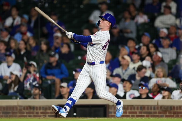 Cubs center fielder Pete Crow-Armstrong (4) hits a triple during the ninth inning against the Reds at Wrigley Field May 4, 2026, in Chicago. (Armando L. Sanchez/Chicago Tribune)