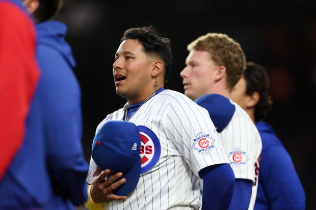 Cubs catcher Moisés Ballesteros (25) sings during the national anthem before the first inning against the Reds at Wrigley Field May 4, 2026, in Chicago. (Armando L. Sanchez/Chicago Tribune)