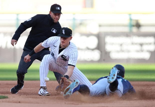 Chicago White Sox shortstop Colson Montgomery (12) catches the ball before tagging out Seattle Mariners center fielder Julio Rodríguez (44) at second base on a steal attempt by Rodríguez in the first inning of a game at Rate Field in Chicago on May 9, 2026. (Chris Sweda/Chicago Tribune)