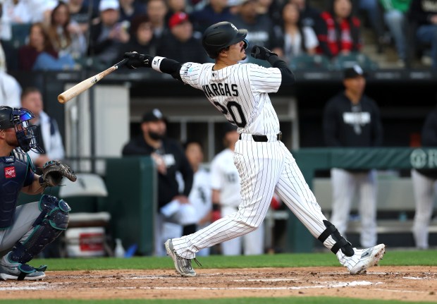 White Sox third baseman Miguel Vargas swings through a two-run home run in the third inning against the Mariners on May 9, 2026, at Rate Field. (Chris Sweda/Chicago Tribune)