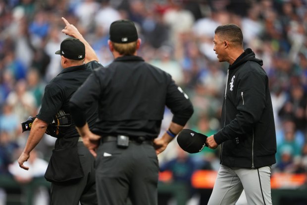 White Sox manager Will Venable is ejected by home plate umpire Tripp Gibson while arguing the call that the Mariners' Jhonny Pereda scored on an RBI double from Randy Arozarena due to player interference from White Sox second baseman Sam Antonacci during the third inning on May 18, 2026, in Seattle. (AP Photo/Lindsey Wasson)