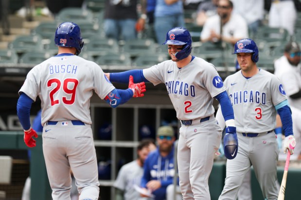 Chicago Cubs second baseman Nico Hoerner (2) celebrates with first baseman Michael Busch (29) after he hit a two-run home run during the first inning against the Chicago White Sox at Rate Field on May 17, 2026. (Eileen T. Meslar/Chicago Tribune)