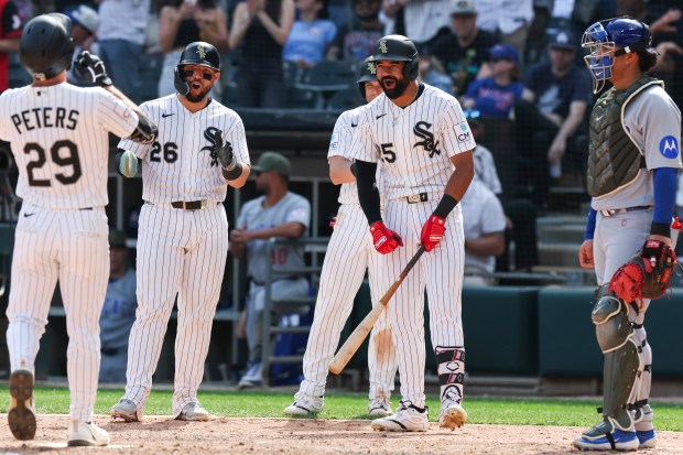 Chicago White Sox center fielder Tristan Peters (29) celebrates with right fielder Derek Hill (25), catcher Edgar Quero (26), and designated hitter Andrew Benintendi (23) after hitting a three-run home run to put the Sox ahead of the Chicago Cubs during the 8th inning at Rate Field on May 17, 2026. (Eileen T. Meslar/Chicago Tribune)