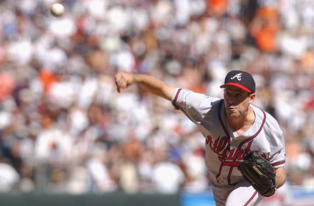 Starting pitcher Greg Maddux #31 of the Atlanta Braves delivers against the San Francisco Giants during the second inning of game three of the National League Western Division Series on October 5, 2002 at the Pacific Bell Park in San Francisco, California.  The Braves won 10-2.  (Photo by Harry How/Getty Images)