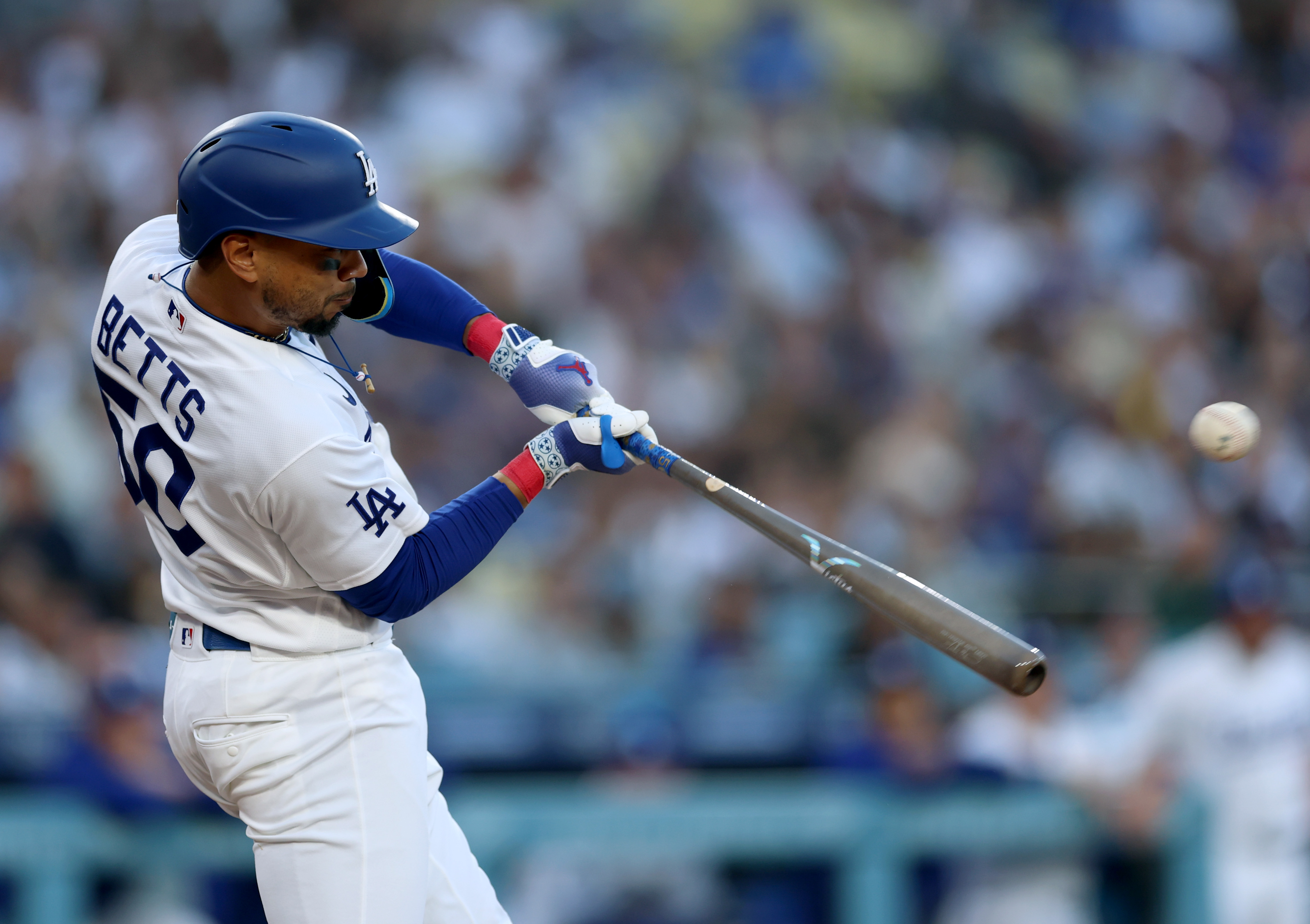 The Dodgers’ Mookie Betts swings at a pitch during the...