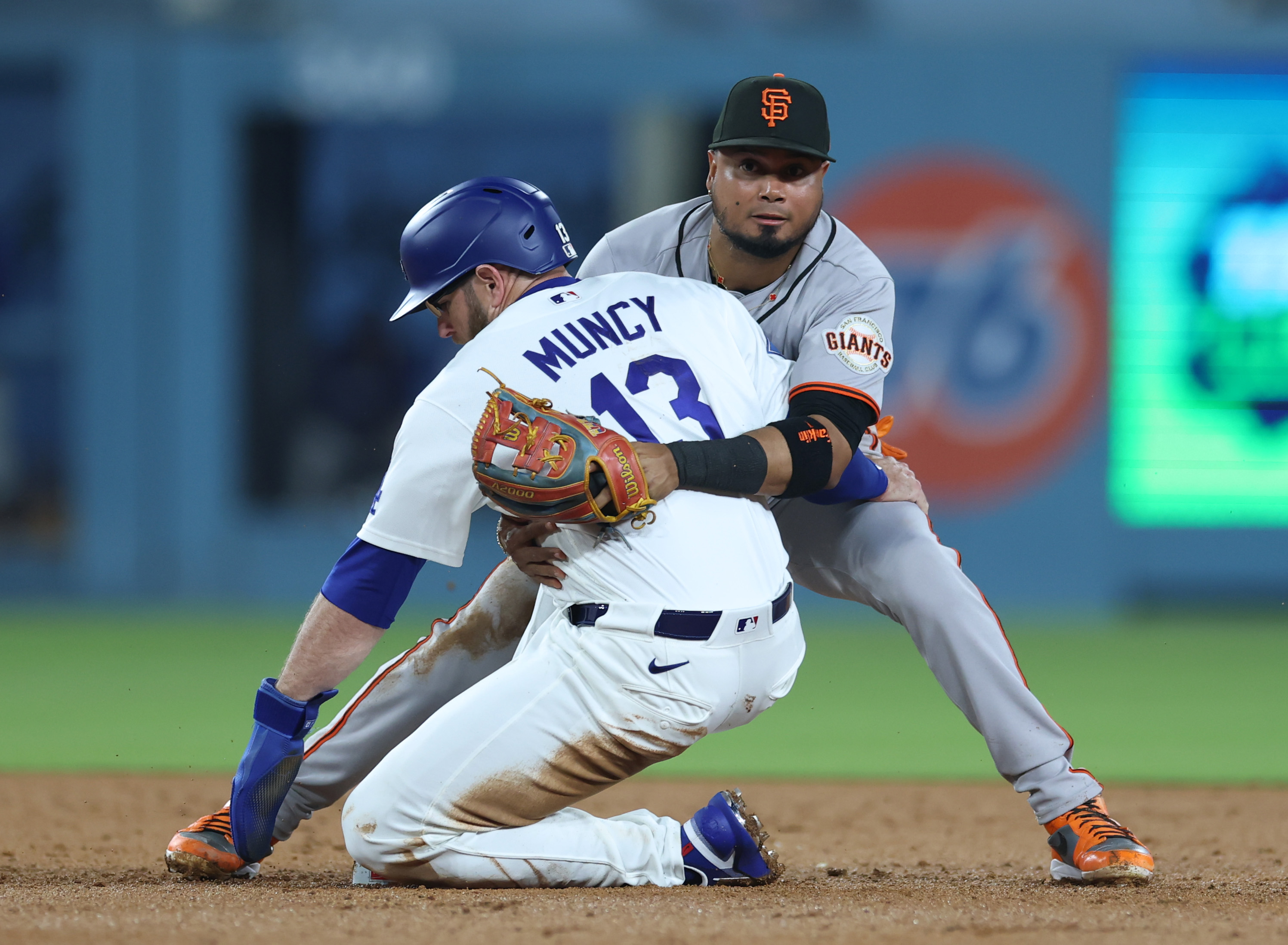 San Francisco Giants second baseman Luis Arraez, right, reacts as...