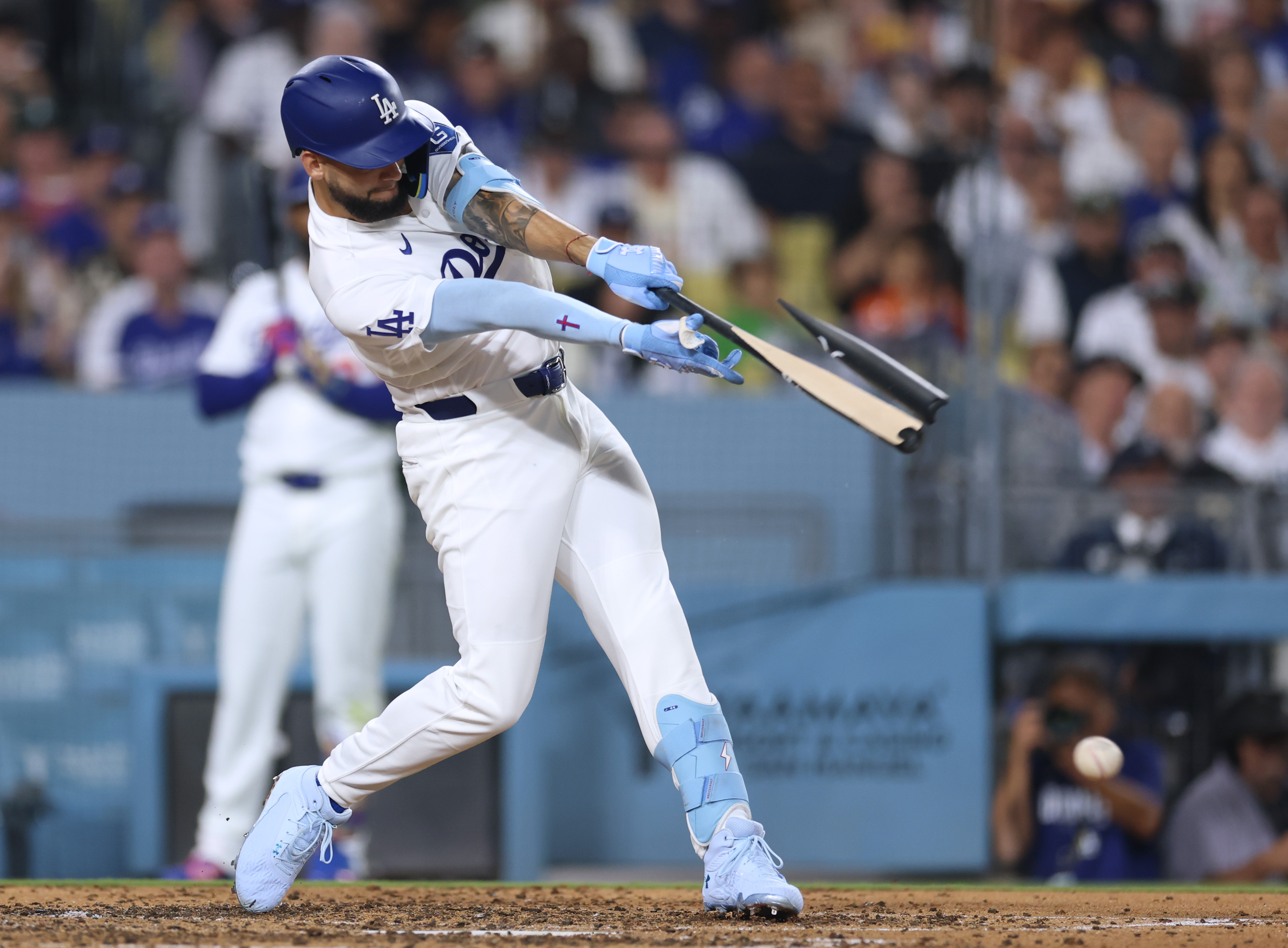 The Dodgers’ Andy Pages breaks his bat while hitting into...