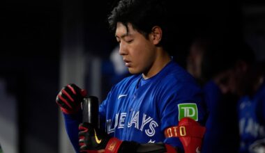 Behind the press corps following a single Toronto Blue Jay