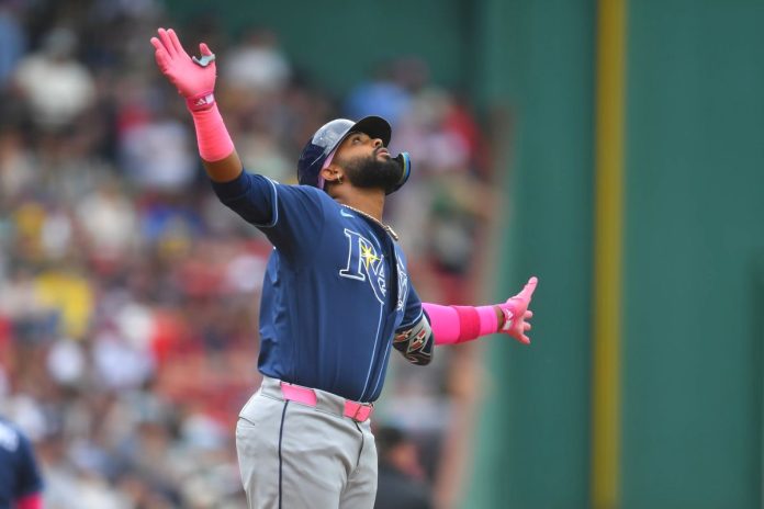Tampa Bay Rays' Junior Caminero celebrates after his home run as he arrives at home plate in the first inning of a baseball game against the Boston Red Sox, Sunday, May 10, 2026, in Boston. (AP Photo/Steven Senne)