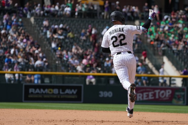 Mickey Moniak, left fielder for the Colorado Rockies, rounds the bases after hitting a home run during a game against the San Diego Padres at Coors Field in Denver on Thursday, April 23, 2026. (Photo by Harmon Dobson/The Denver Post)