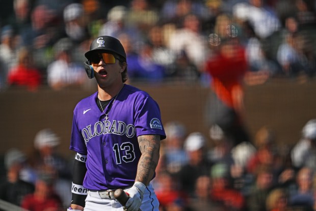 Rockies outfielder Zac Veen walks back to the dugout after striking out during the team's Cactus League opener at Salt River Field at Talking Stick in Scottsdale, Arizona on Friday, Feb. 20, 2026. The Arizona Diamondbacks went onto beat the Colorado Rockies 3-2. (Photo by RJ Sangosti/The Denver Post)