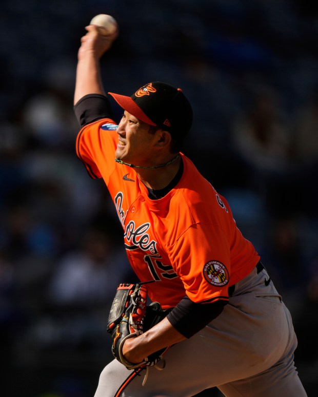 Baltimore Orioles starting pitcher Tomoyuki Sugano throws during the fifth inning of a baseball game against the Kansas City Royals, Saturday, April 5, 2025, in Kansas City, Mo. (AP Photo/Charlie Riedel)