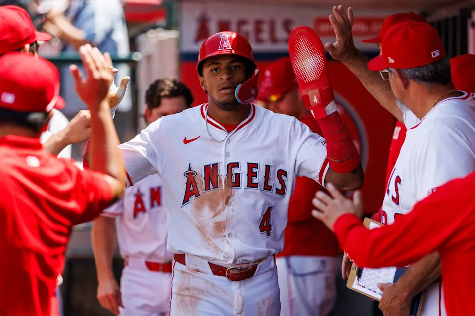 Christian Moore #4 of the Los Angeles Angels celebrates in the dugout during the game against the Boston Red Sox at Angel Stadium of Anaheim on June 25, 2025 in Anaheim, California. 