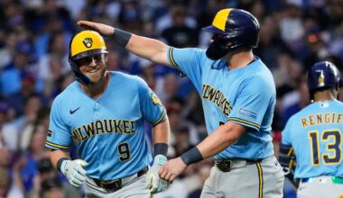 Milwaukee Brewers' Jake Bauers, left, is congratulated by Andrew Vaughn after hitting a three-run home run during the fifth inning of a baseball game against the Chicago Cubs in Chicago, Monday, May 18, 2026.