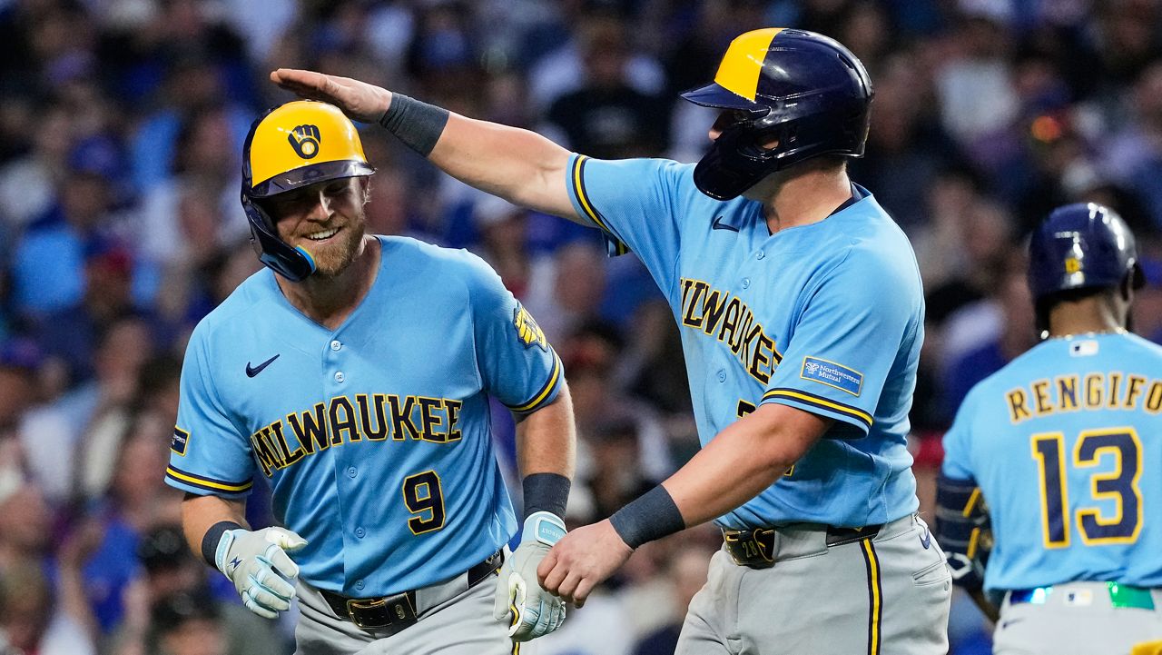 Milwaukee Brewers' Jake Bauers, left, is congratulated by Andrew Vaughn after hitting a three-run home run during the fifth inning of a baseball game against the Chicago Cubs in Chicago, Monday, May 18, 2026.