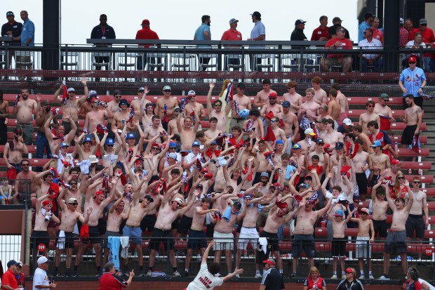 Fans known as the "Tarps Off" crew cheer during a game between the St. Louis Cardinals and the Pittsburgh Pirates at Busch Stadium on May 21, 2026, in St Louis. (Dilip Vishwanat/Getty Images)