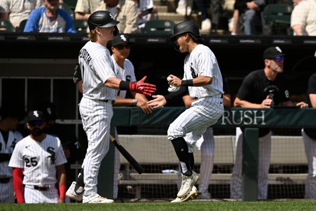 Chicago White Sox's Rikuu Nishida, right, celebrates with teammate Chase Meidroth, left, after hitting an RBI single during the seventh inning of a baseball against the Detroit Tigers in Chicago, Saturday, May 30, 2026. (AP Photo/Paul Beaty)