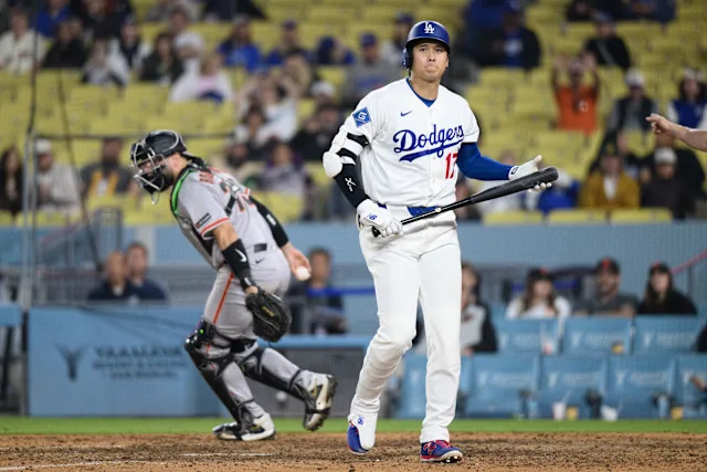 Los Angeles Dodgers' Shohei Ohtani walks back to the dugout after striking out during the ninth inning of a baseball game against the San Francisco Giants in Los Angeles, Monday, May 11, 2026. (AP Photo/Kyusung Gong)