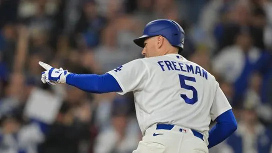 Los Angeles Dodgers first baseman Freddie Freeman (5) celebrates a solo home run during the sixth inning against the Atlanta Braves at Dodger Stadium.