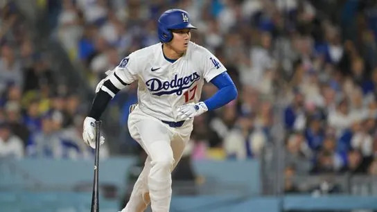 Los Angeles Dodgers two-way player Shohei Ohtani (17) hits an RBI double during the fifth inning against the Atlanta Braves at Dodger Stadium.
