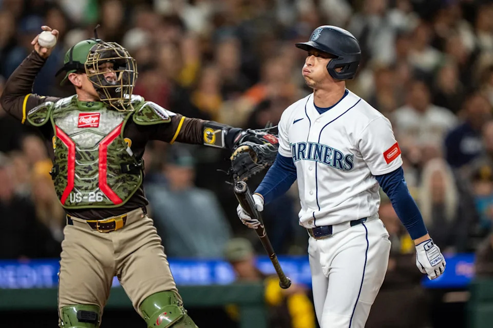 Seattle Mariners designated hitter Rob Refsnyder walks away after striking out during a game against the San Diego Padres on Friday at T-Mobile Park in Seattle. | Stephen Brashear/Imagn Images.