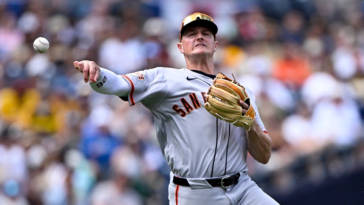 San Francisco Giants third baseman Matt Chapman throwing to first base at Petco Park