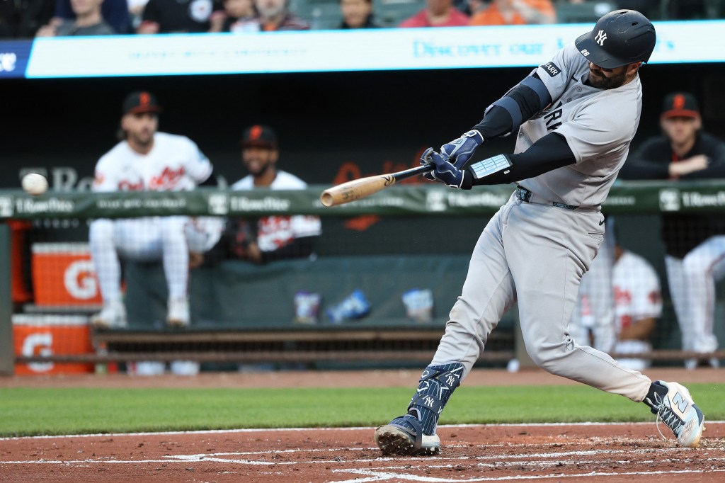 New York Yankees catcher Austin Wells (28) hits a single.