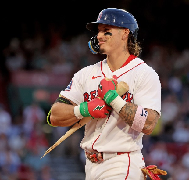 Boston, - May 27 - Boston Red Sox left fielder Jarren Duran (16) hugs his broken bat after he hits a single during the fourth inning at Fenway Park. (Photo By Matt Stone/Boston Herald).