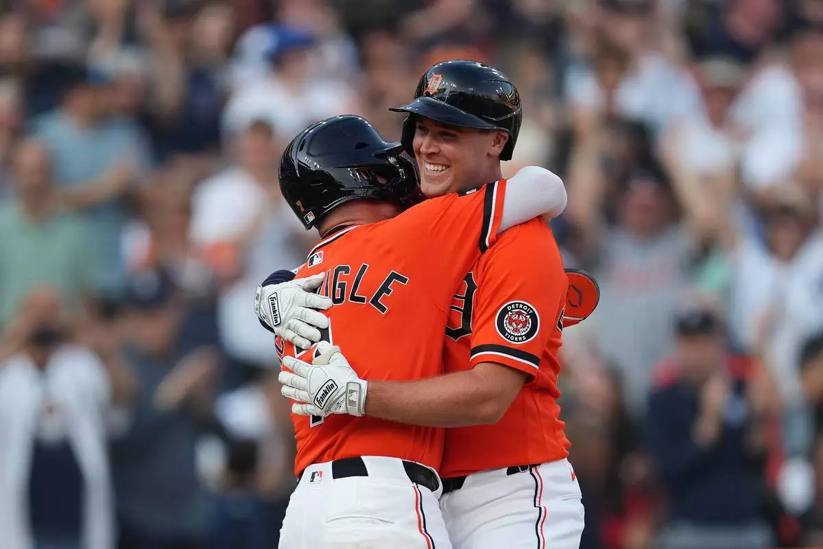 Detroit Tigers' Kerry Carpenter, right, celebrates his two-run home run with Kevin McGonigle, left, against the Houston Astros during the third inning of a baseball game Friday, June 26, 2026, in Detroit. (AP Photo/Paul Sancya)