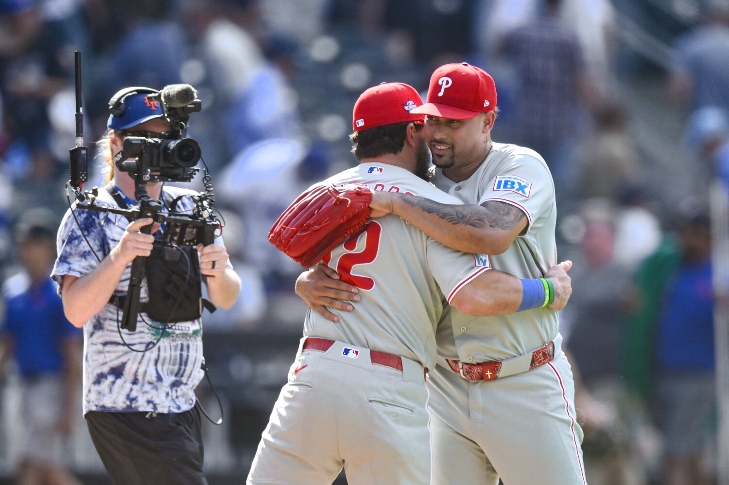 Jun 28, 2026; New York City, New York, USA; Philadelphia Phillies designated hitter Kyle Schwarber (12) and pitcher Jhoan Duran (59) embrace after winning against the New York Mets at Citi Field. Mandatory Credit: John Jones-Imagn Images
