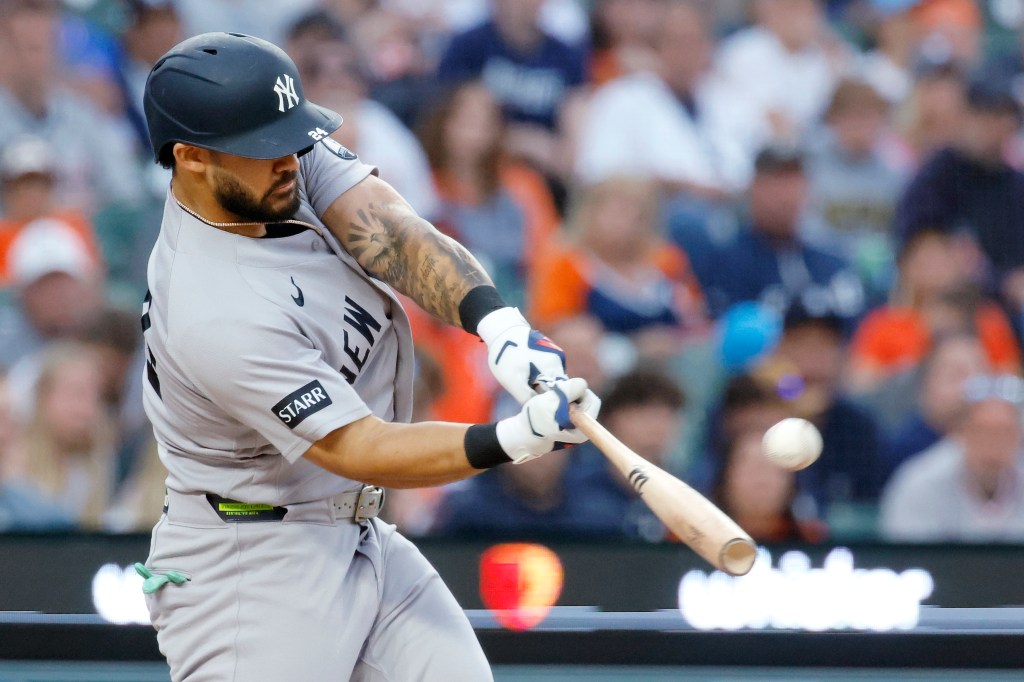 Jasson Dominguez #24 of the New York Yankees hits a two-run home run against the Detroit Tigers during the sixth inning at Comerica Park on June 24, 2026 in Detroit, Michigan. 