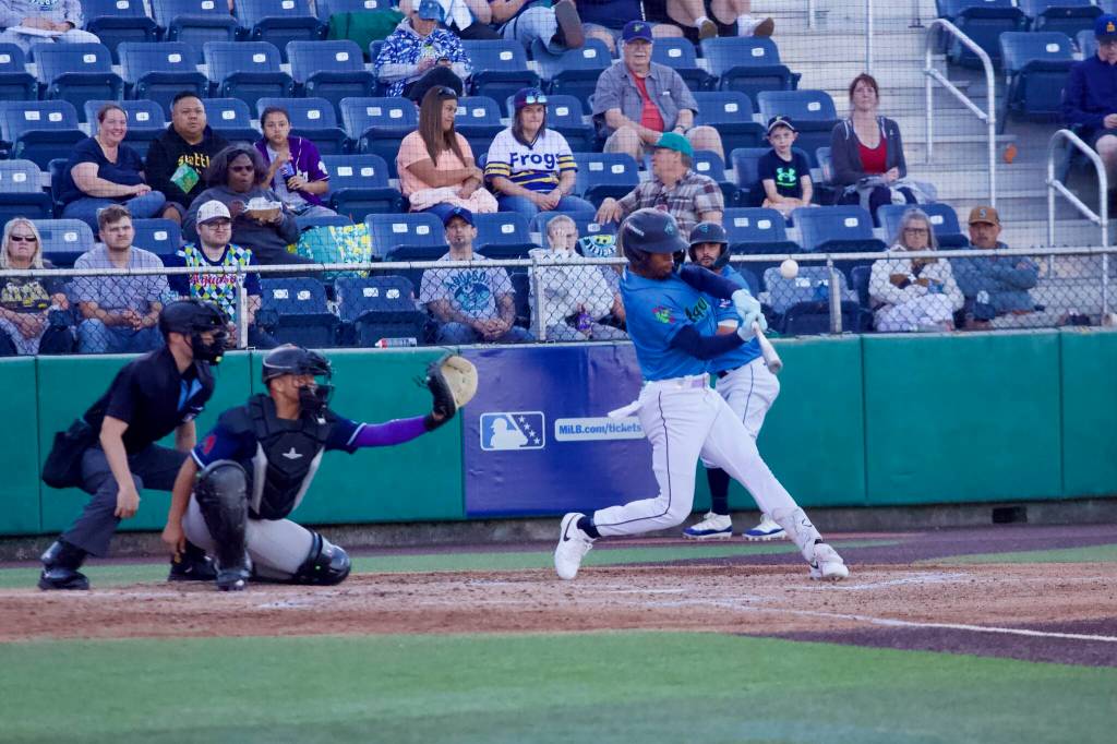 AquaSox outfielder Curtis Washington Jr. connects on a pitch during Everetts game against the Hillsboro Hopes at Everett Memorial Stadium on June 18, 2026. (Joe Pohoryles / The Herald)
