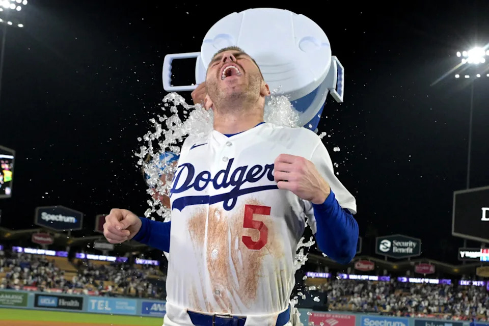 Jun 5, 2026; Los Angeles, California, USA; Los Angeles Dodgers left fielder <a class="link " href="https://sports.yahoo.com/mlb/players/12653/" data-i13n="sec:content-canvas;subsec:anchor_text;elm:context_link" data-ylk="slk:Alex Call;sec:content-canvas;subsec:anchor_text;elm:context_link;itc:0" data-yga="{"yLinkElement":"context_link","yModuleName":"content-canvas","yLinkText":"Alex Call","ySubModuleName":"anchor_text","yHasCommerce":false}">Alex Call</a> (12) dumps a cooler of ice water on first baseman Freddie Freeman (5) after hitting a walk-off home run Los Angeles Angels in the ninth inning at Dodger Stadium. Mandatory Credit: Jayne Kamin-Oncea-Imagn Images