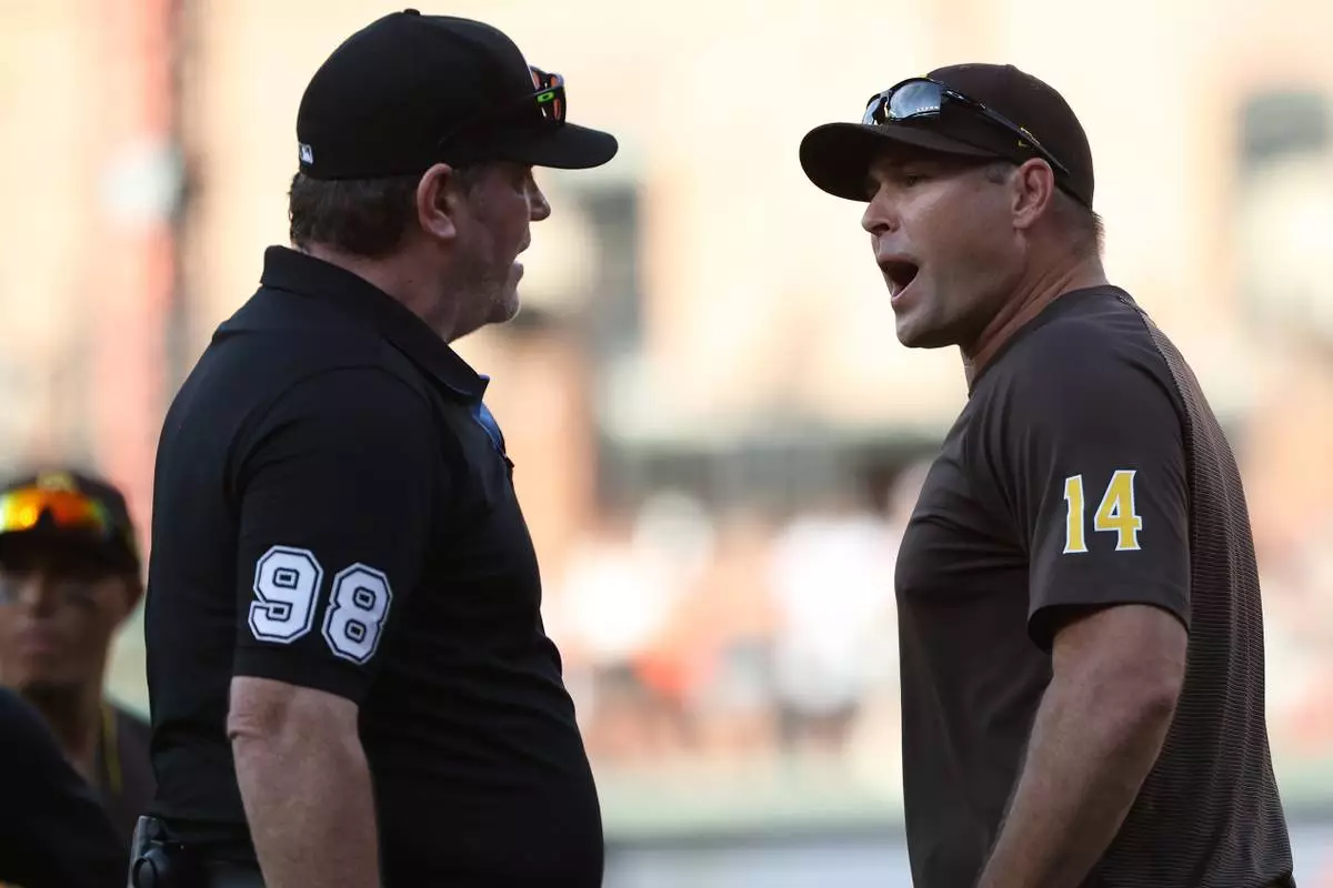 San Diego Padres manager Craig Stammen gets ejected by umpire Chris Conroy during the ninth inning of a baseball game against the Baltimore Orioles, Saturday, June 13, 2026, in Baltimore. (AP Photo/Daniel Kucin Jr.)