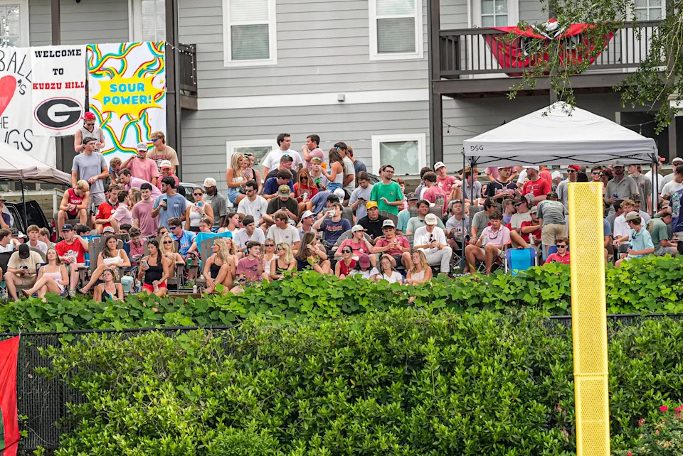 May 29, 2026; Athens, GA, USA; Georgia Bulldogs fans watch the game against the Liberty Flames from Kudzu Hill outside of Foley Field. Mandatory Credit: Dale Zanine-Imagn Images