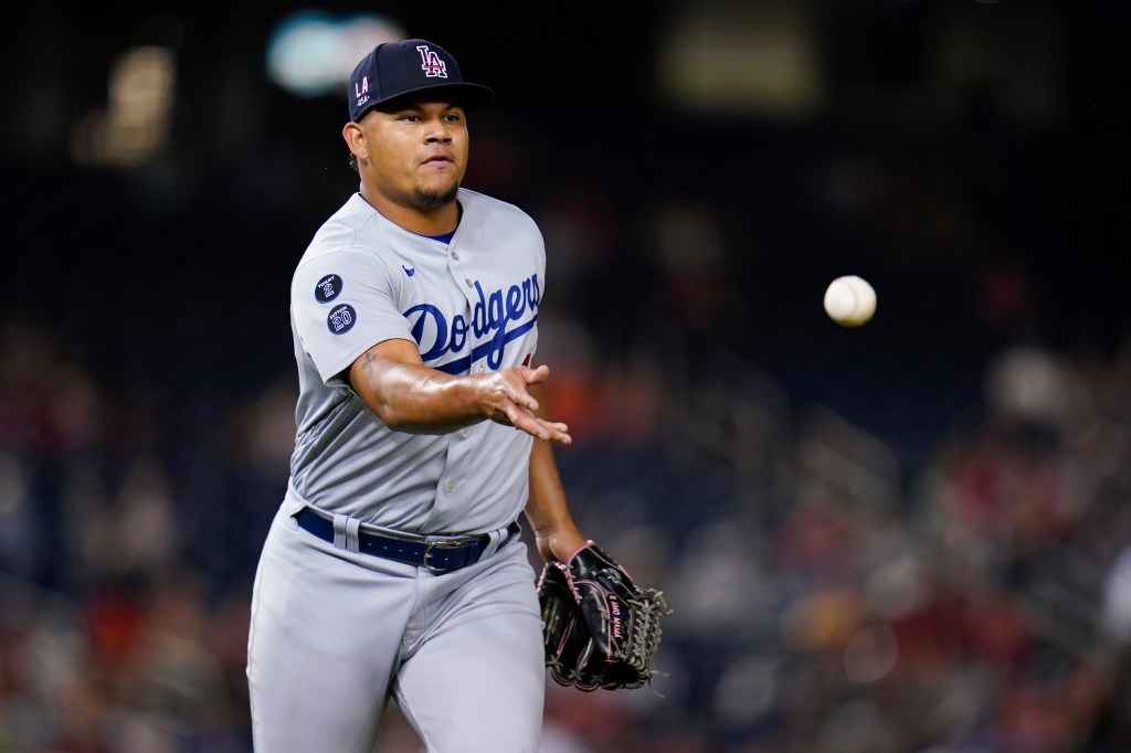 Dodgers player Brusdar Graterol throwing a baseball.