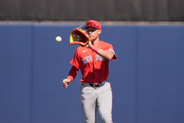 Boston Red Sox second baseman Kristian Campbell fields a single by Tampa Bay Rays Carson Williams in the third inning of a spring training baseball game in Port Charlotte, Fla., Monday, Feb. 23, 2026. (AP Photo/Gerald Herbert)