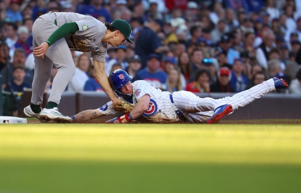 Chicago Cubs center fielder Pete Crow-Armstrong is tagged out by Athletics third baseman Zack Gelof as Crow-Armstrong tries to steal third base in the first inning of a game at Wrigley Field in Chicago on June 2, 2026. (Chris Sweda/Chicago Tribune)