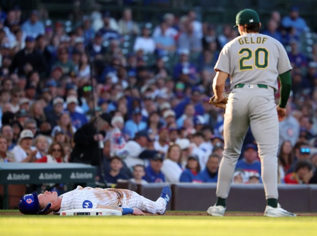 Chicago Cubs center fielder Pete Crow-Armstrong lays on the ground after being tagged out by Athletics third baseman Zack Gelof (20) after Crow-Armstrong tried to steal third base in the first inning of a game at Wrigley Field in Chicago on June 2, 2026. (Chris Sweda/Chicago Tribune)