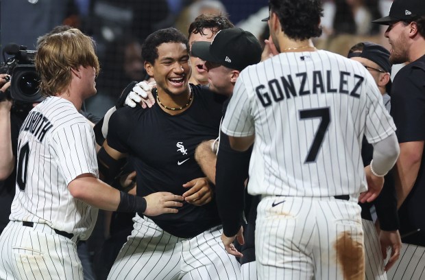 Chicago White Sox right fielder Braden Montgomery (center) celebrates with his teammates after hitting a walk-off two-run home run in the tenth inning of a game against the Atlanta Braves at Rate Field in Chicago on June 9, 2026. (Chris Sweda/Chicago Tribune)