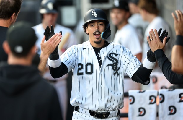 Chicago White Sox first baseman Miguel Vargas (20) is congratulated by his teammates in the dugout after hitting a solo home run in the sixth inning of a game against the Cleveland Guardians at Rate Field in Chicago on June 23, 2026. (Chris Sweda/Chicago Tribune)